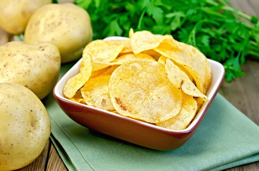 potato chips clay bowl napkin fresh potatoes